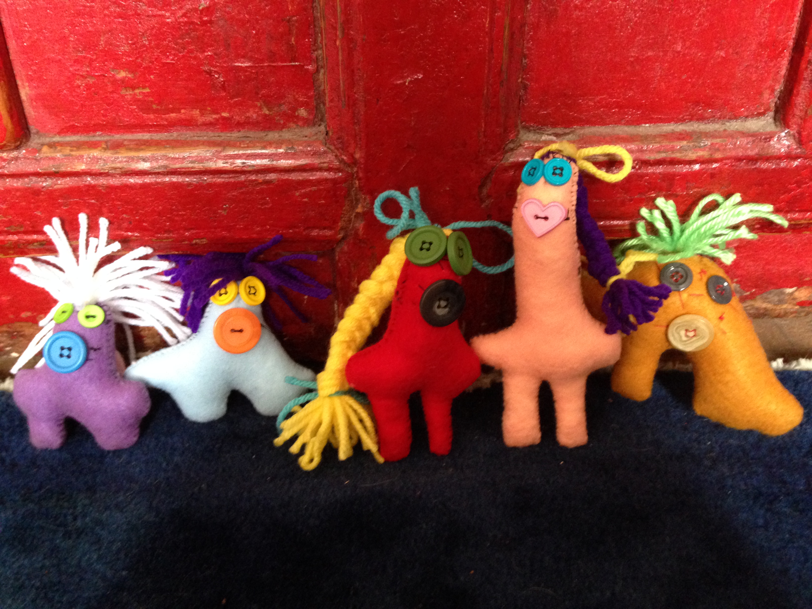 A collection of Sam’s smallest handmade dolls