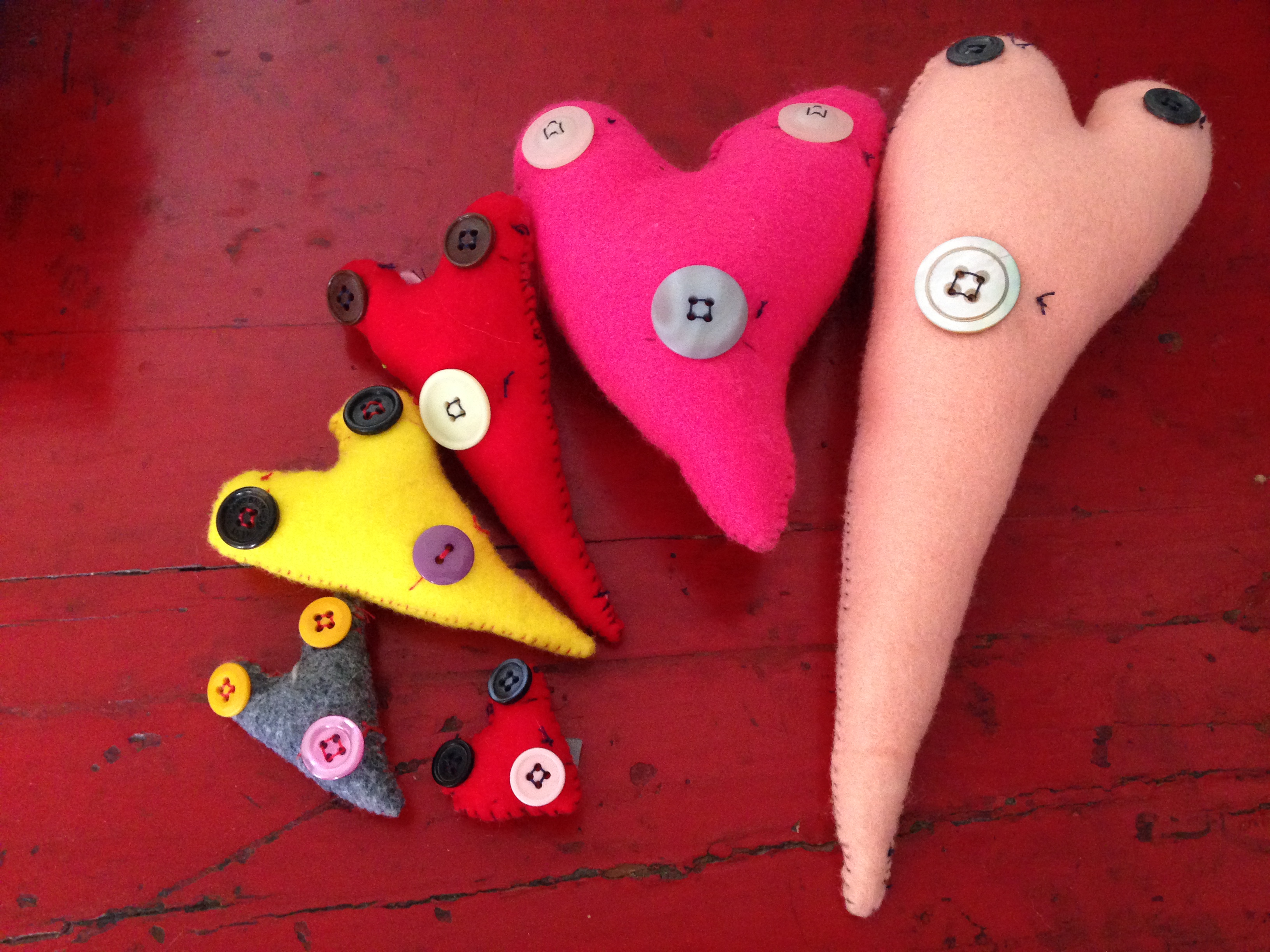 Handmade felt hearts with button faces
